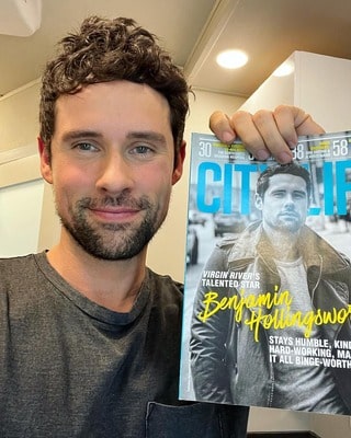 A beautiful portrait of Ben Hollingsworth where he is holding his featured magazine